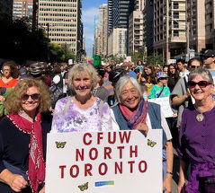 CFUW North Toronto members pose with a sign at a climate demonstration in 2019